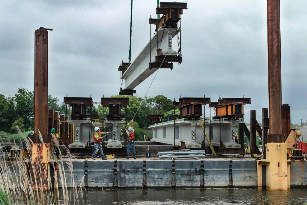 RK&K Team Members Maneuver Crossbeam into place on the Christina River Barge