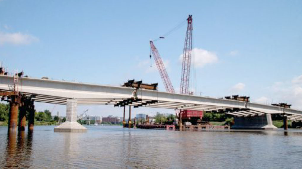 Strongbacks temporarily support Christina River Bridge girder segments
