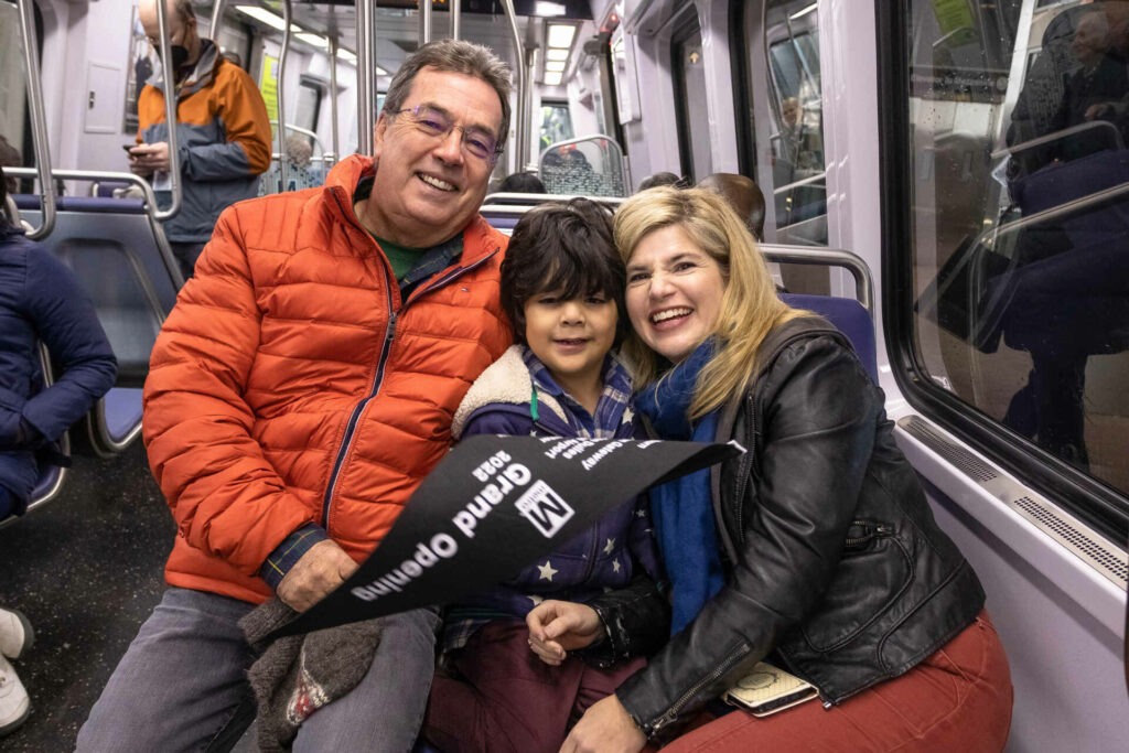 A family enjoys the inaugural ride of Metro’s Silver Line Extension