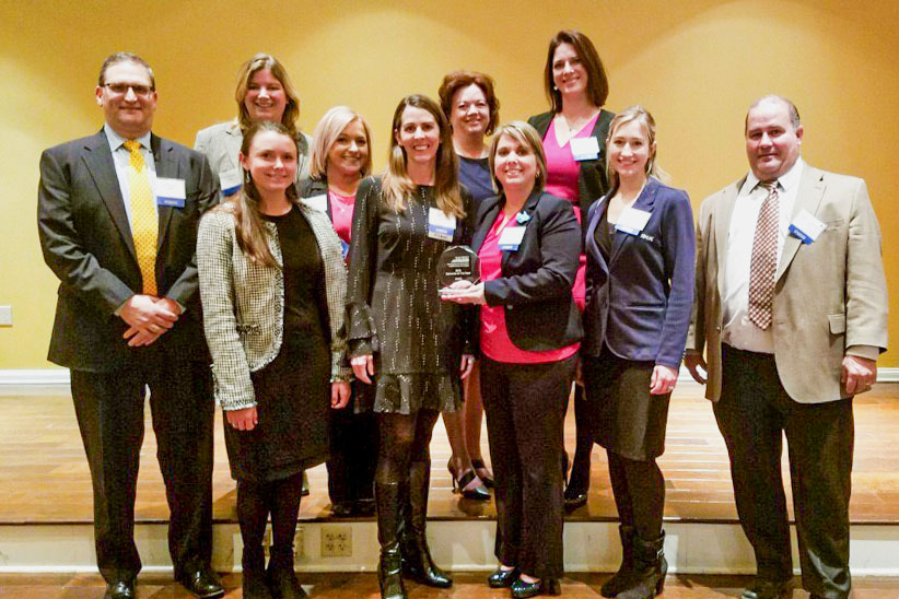 RK&K Team Members pose with the WTS Award for Employer of the Year.