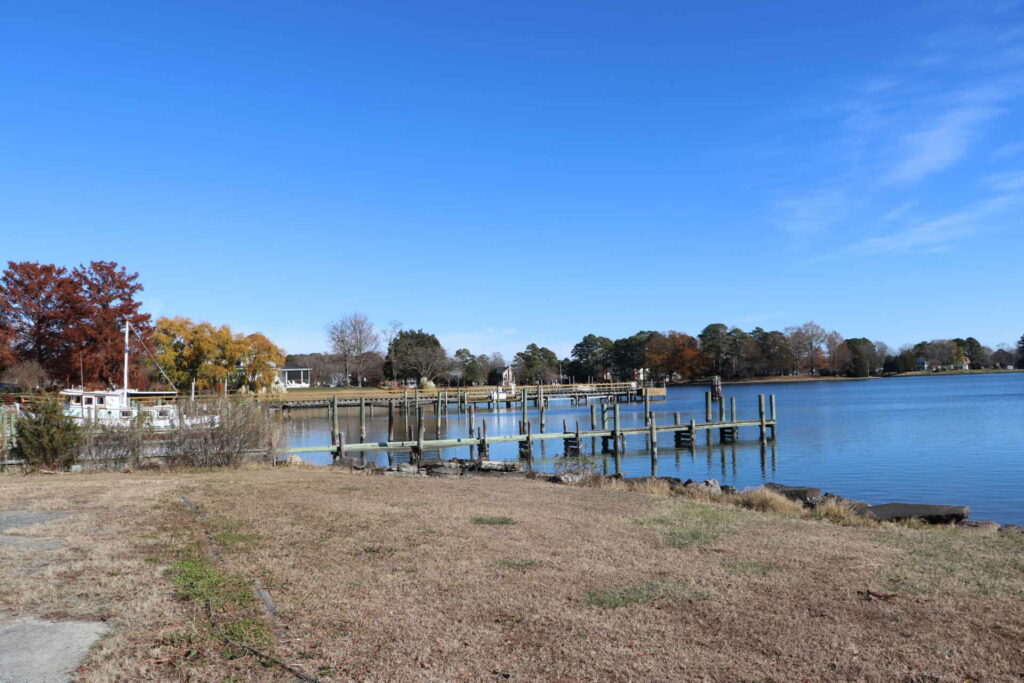 a house with a dock on the water.