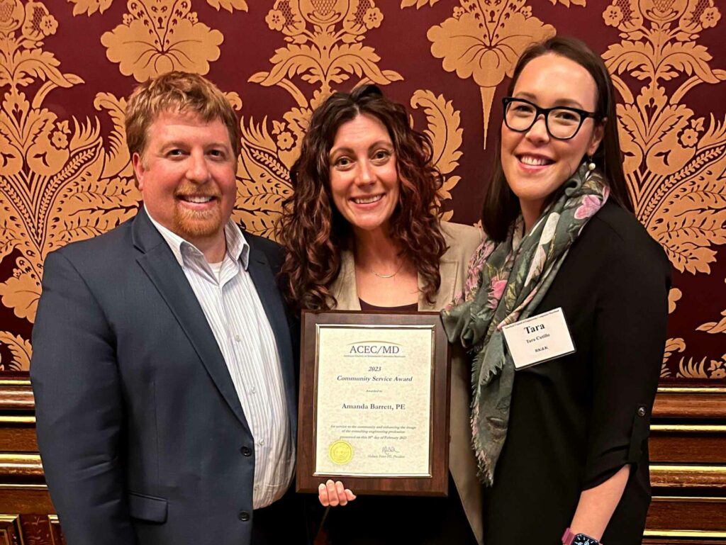 Senior Project Engineer Amanda Barrett, PE (center) received the 2023 Community Service Award from ASCE/MD.