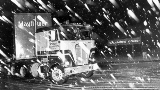 A moving van carrying equipment for the Baltimore Colts leaves in the middle of the night for Indianapolis on March 29, 1984. (Courtesy: Lloyd Pearson, AP File)