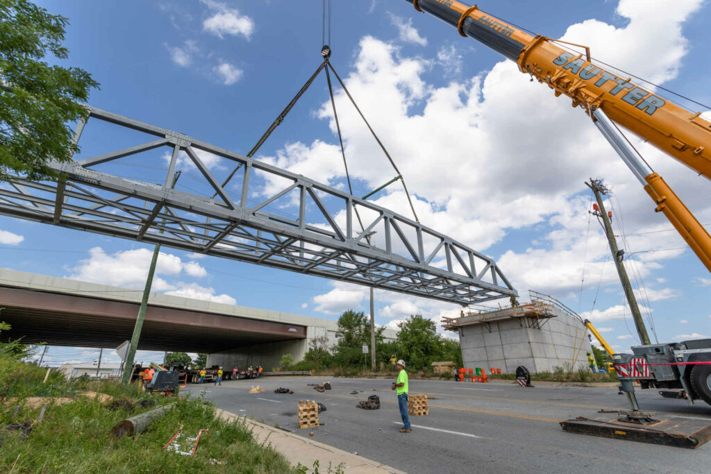 Chester Valley Trail pedestrian truss erection. Lifting the extension into place.